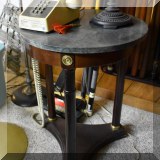 F128. Marble top side table with three column legs.